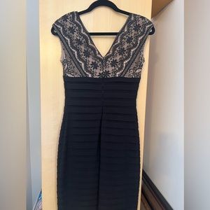 Cute little black dress. Worn once for wedding.  Great fit and style!